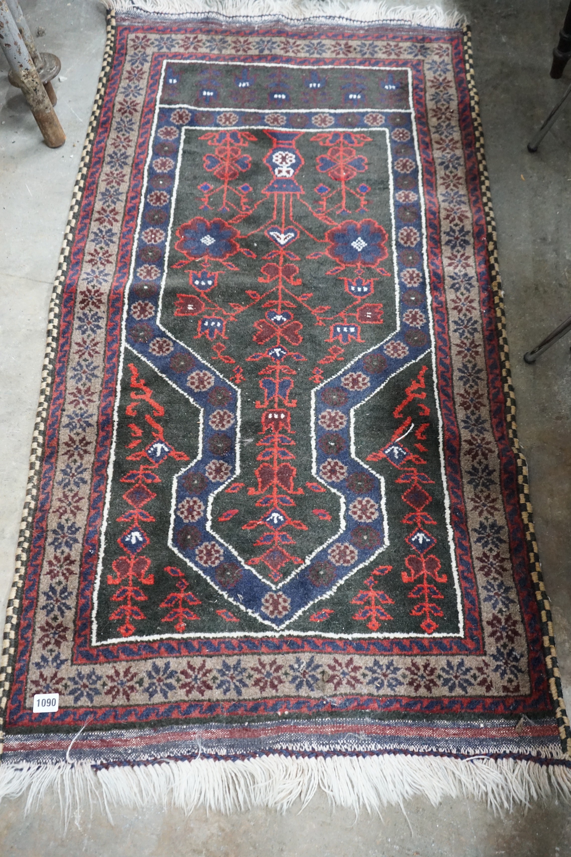 A Belouch blue ground prayer rug, 140 x 74cm